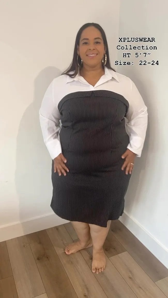 Woman in plus size white button-up shirt over black ribbed strapless dress