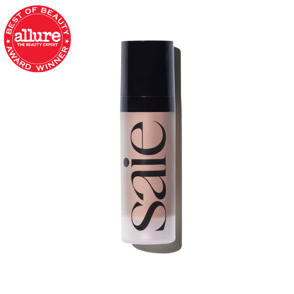Beige liquid foundation bottle with black label and Allure Best of Beauty award seal